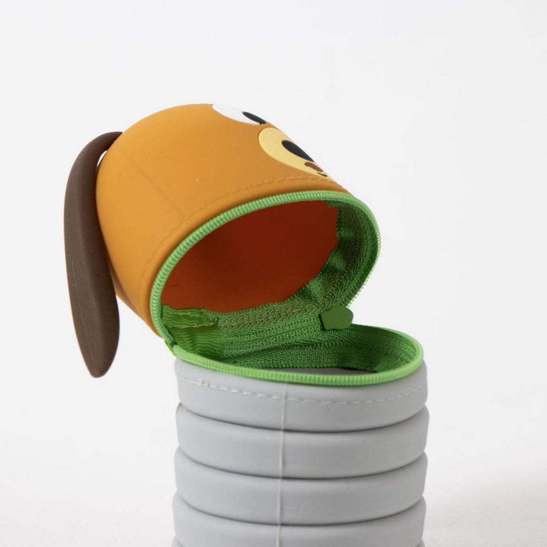 Children's shoe with a cartoon face design on an orange sole, open to reveal a green interior.