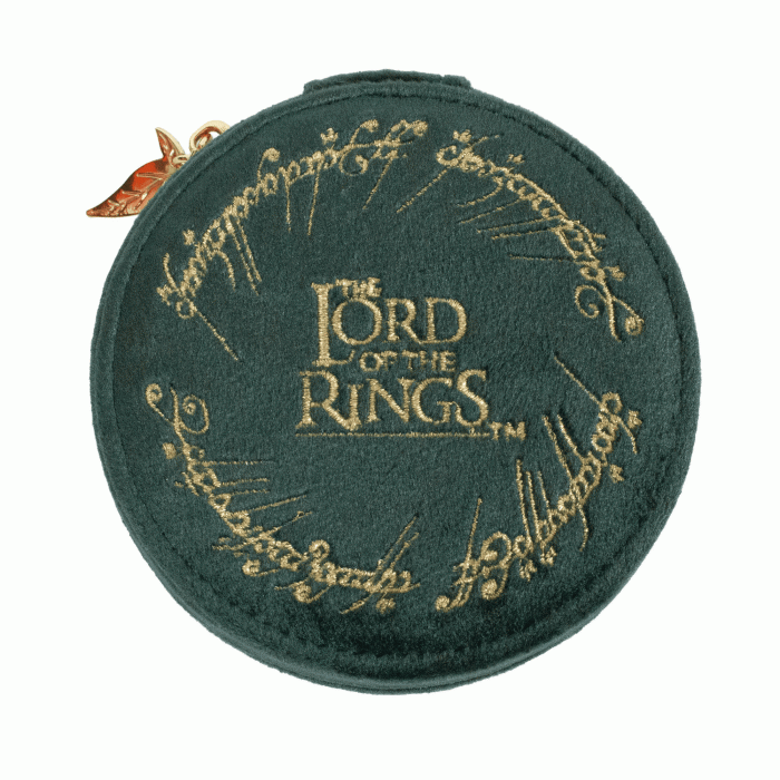 A round dark green velvet coin purse featuring gold embroidered 'The Lord of the Rings' ring script and the central logo, with a small metallic wing charm on the left side, set against a plain white background.