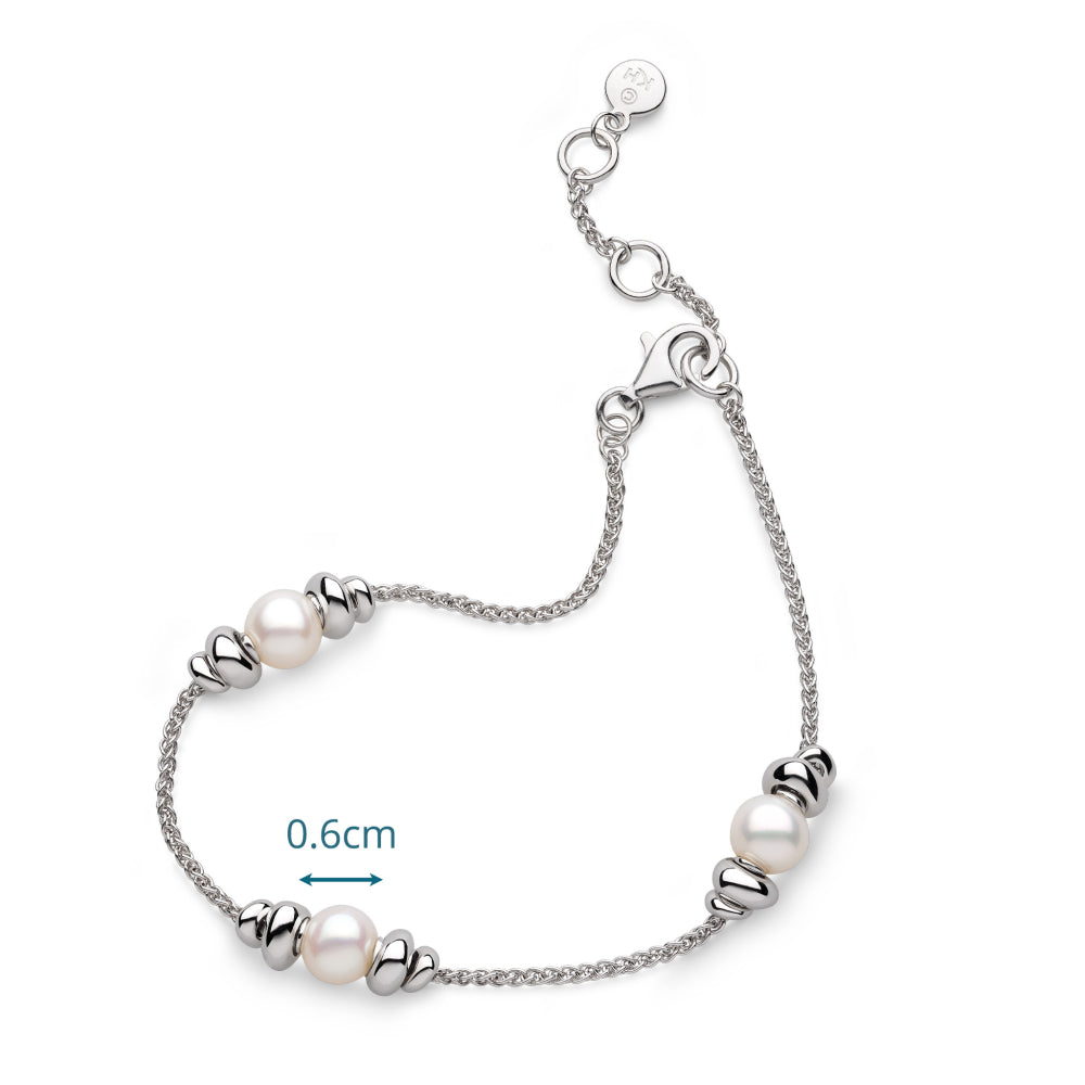 Silver bracelet with pearls on a white background