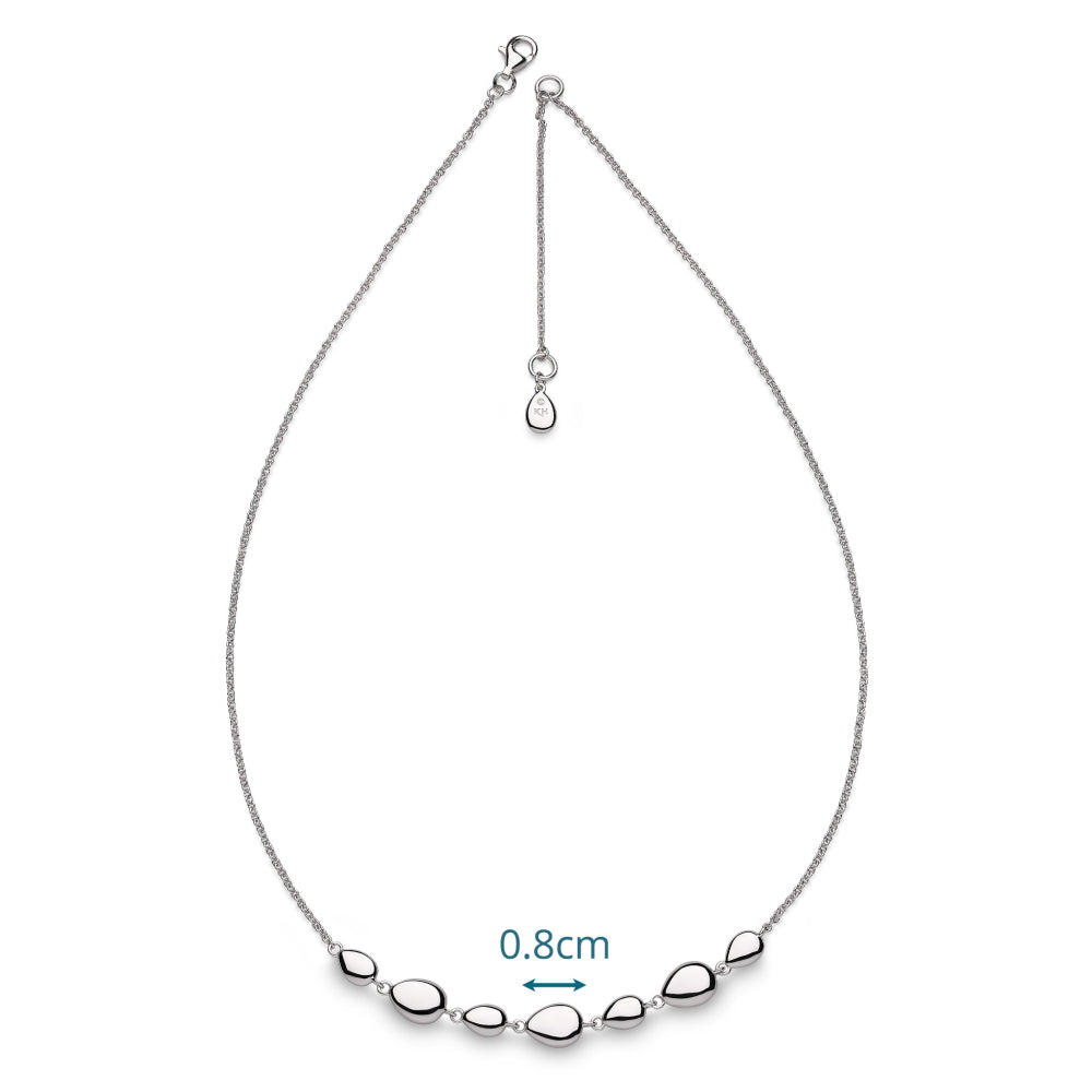 Silver necklace with teardrop-shaped beads on a white background