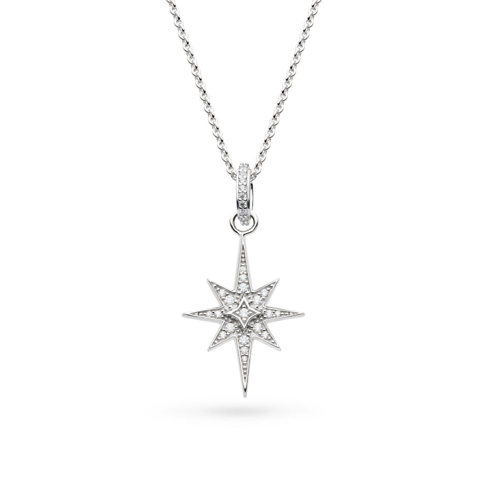 Star-shaped silver pendant with clear stones on a white background