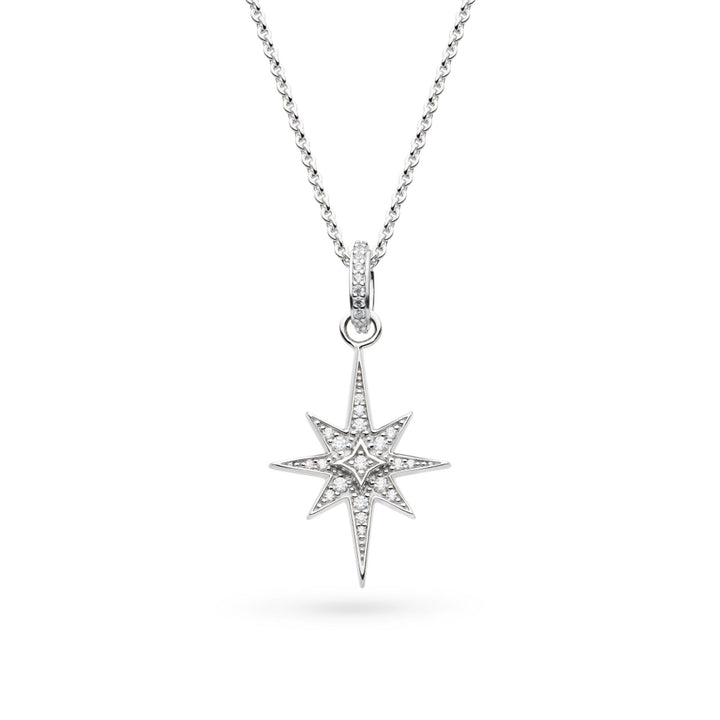 Star-shaped silver pendant with clear stones on a white background