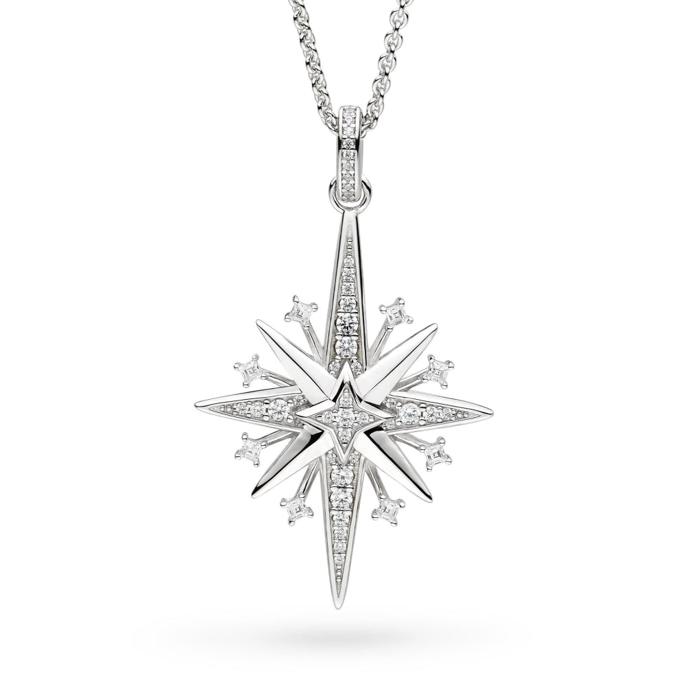 Star-shaped silver pendant with diamond accents on a white background
