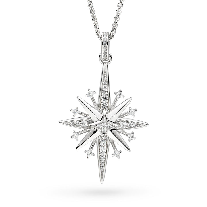 Star-shaped silver pendant with diamond accents on a white background