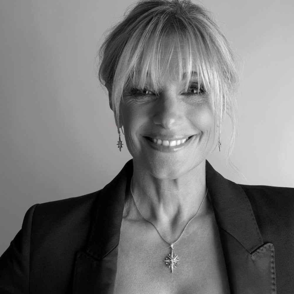 Black and white portrait of a woman with a neutral background