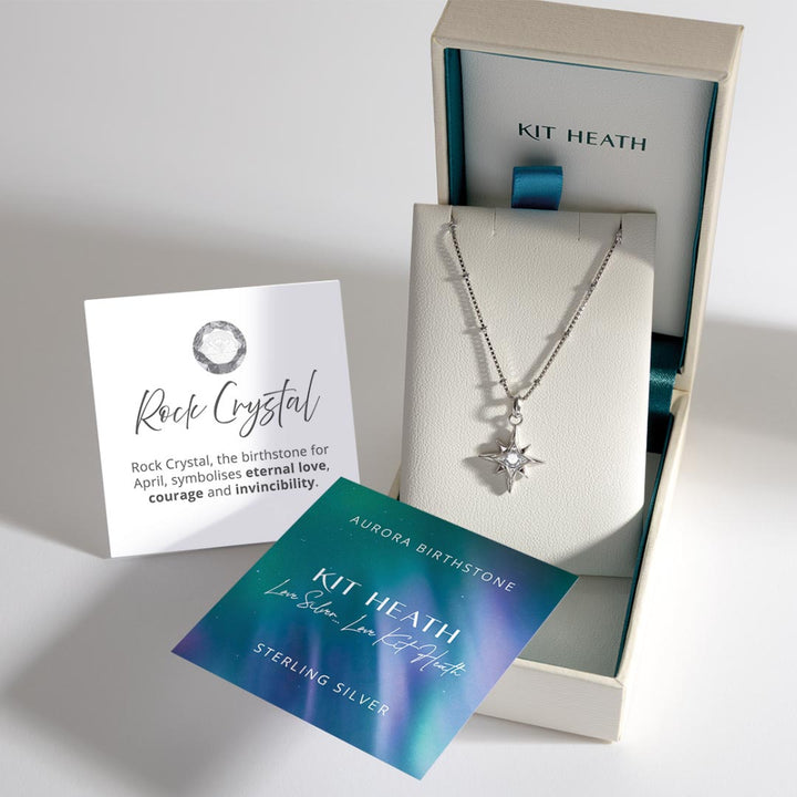 Silver necklace with star pendant in Kit Heath box, accompanied by descriptive cards.