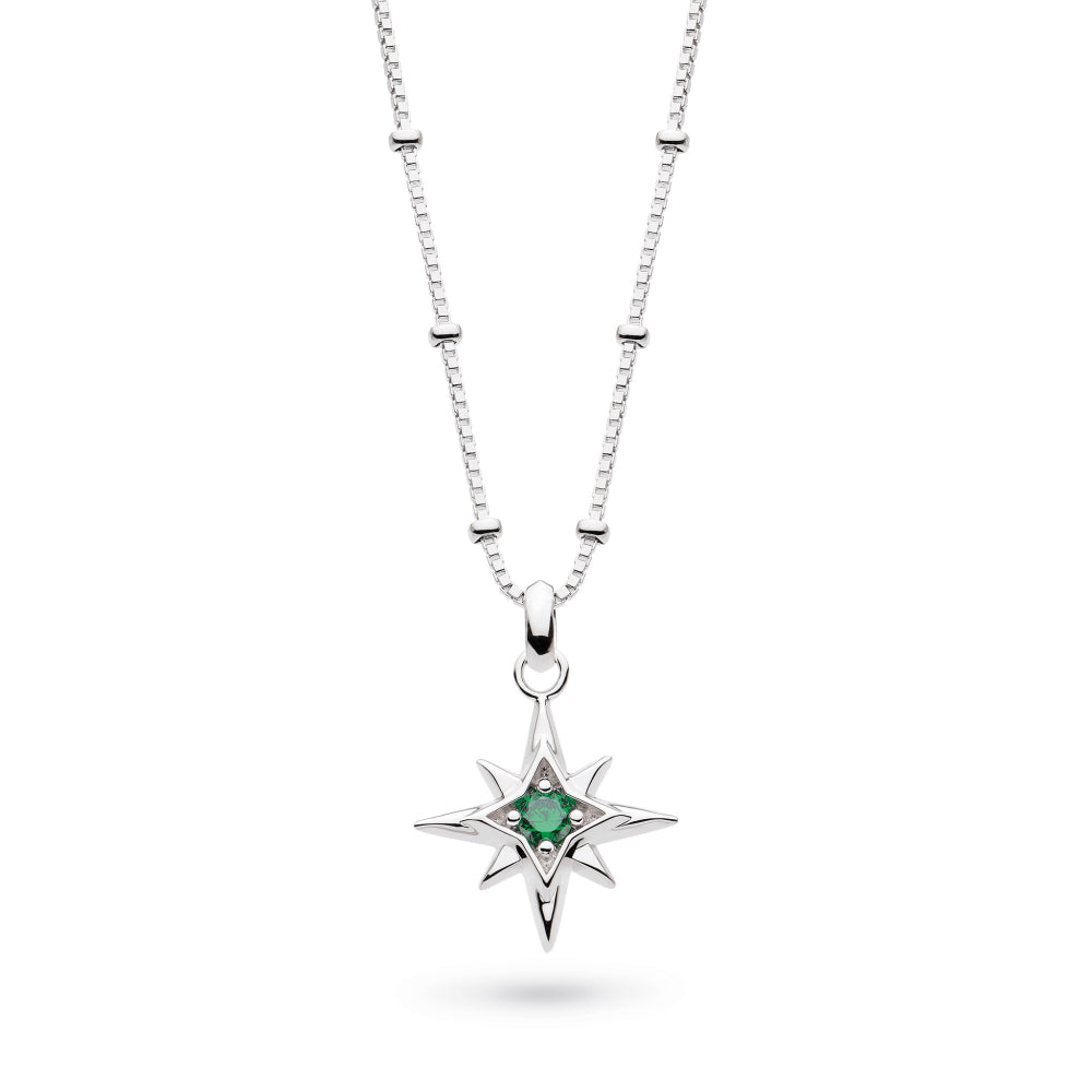 Silver necklace with a star-shaped pendant featuring a green gemstone on a white background