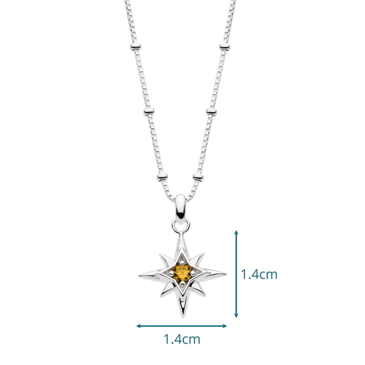 Silver necklace with a star-shaped pendant featuring a yellow gemstone, shown on a white background.