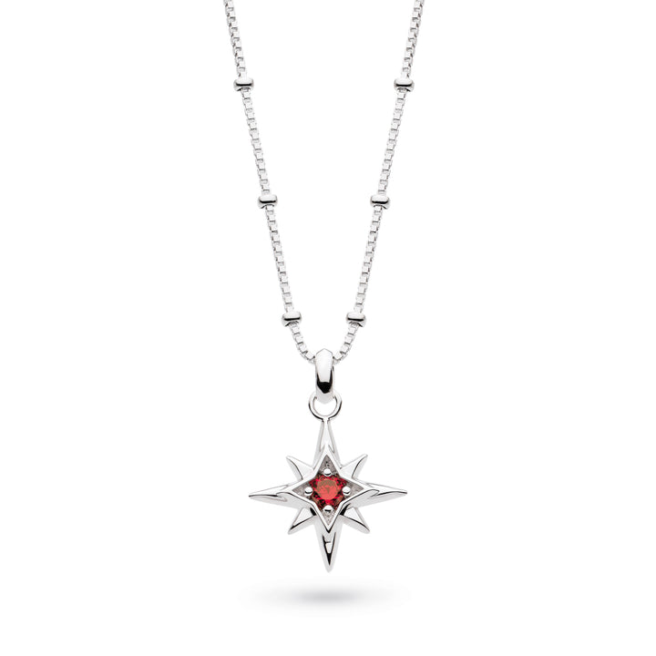 Silver necklace with a star-shaped pendant featuring a red gemstone on a white background