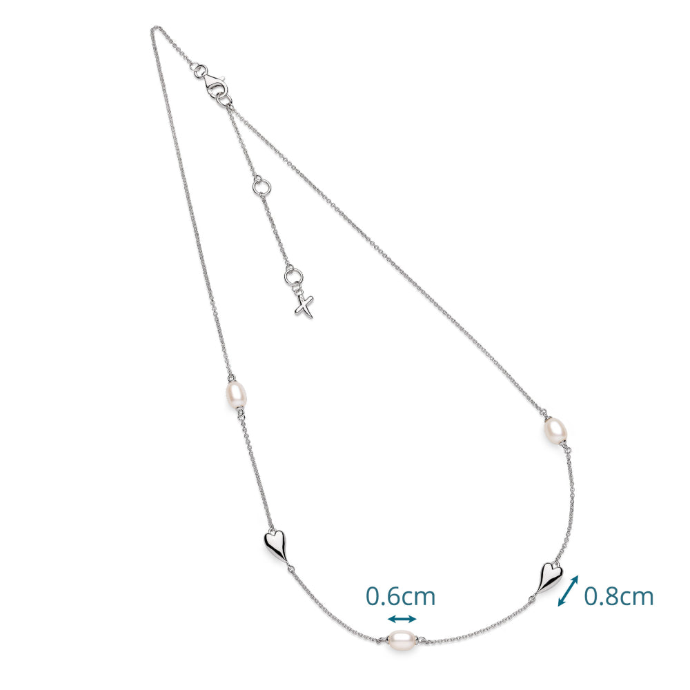 Silver necklace with heart and pearl details on a white background