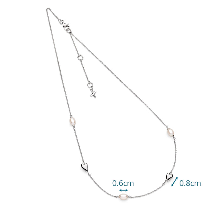 Silver necklace with heart and pearl details on a white background
