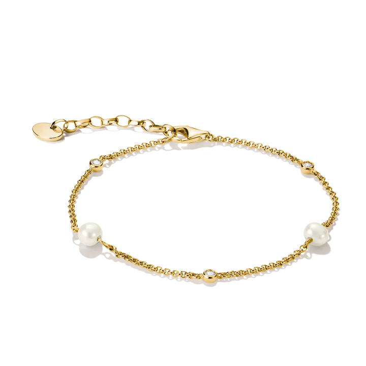 A delicate gold chain bracelet featuring three white pearl beads spaced along the chain, displayed on a clean white background.