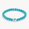 Turquoise beaded bracelet with silver clasp on a white background