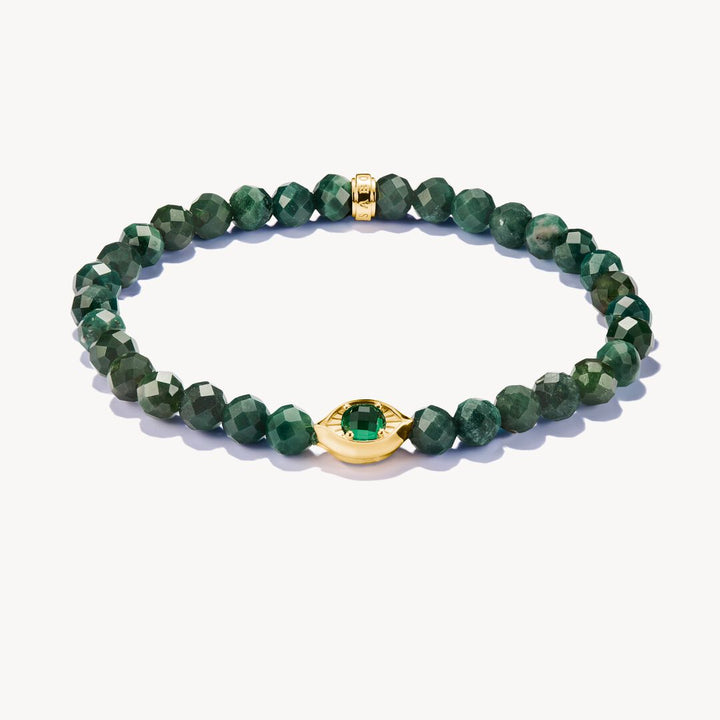 Green beaded bracelet with gold accents on a white background