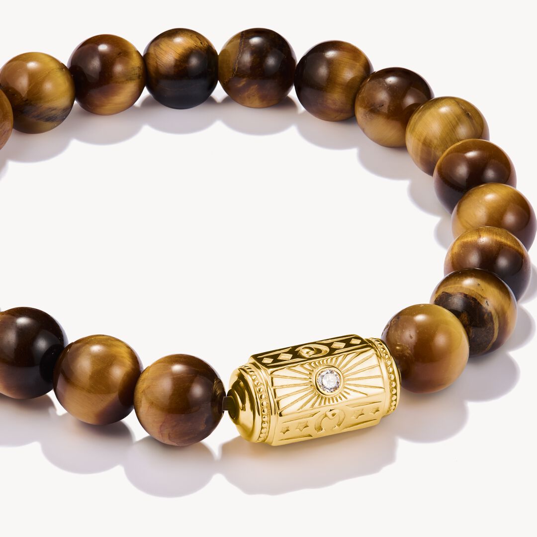 Beaded bracelet with gold clasp on a white background