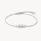 Silver bracelet with a small diamond on a white background