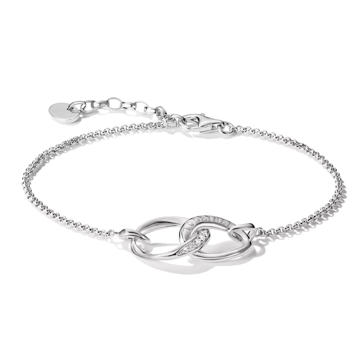 A silver chain bracelet with interlocking oval links, one of which is adorned with small clear stones, shown on a white background.