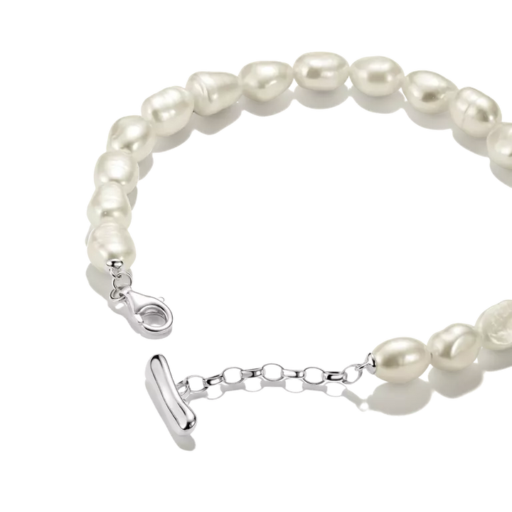 A baroque pearl bracelet with a polished silver clasp and extender chain, shown on a clean white background.