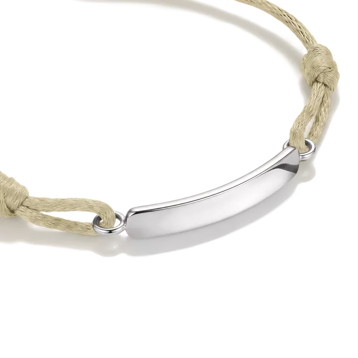 A silver-toned curved bar nameplate bracelet on a light blue cord, shown on a clean white background.