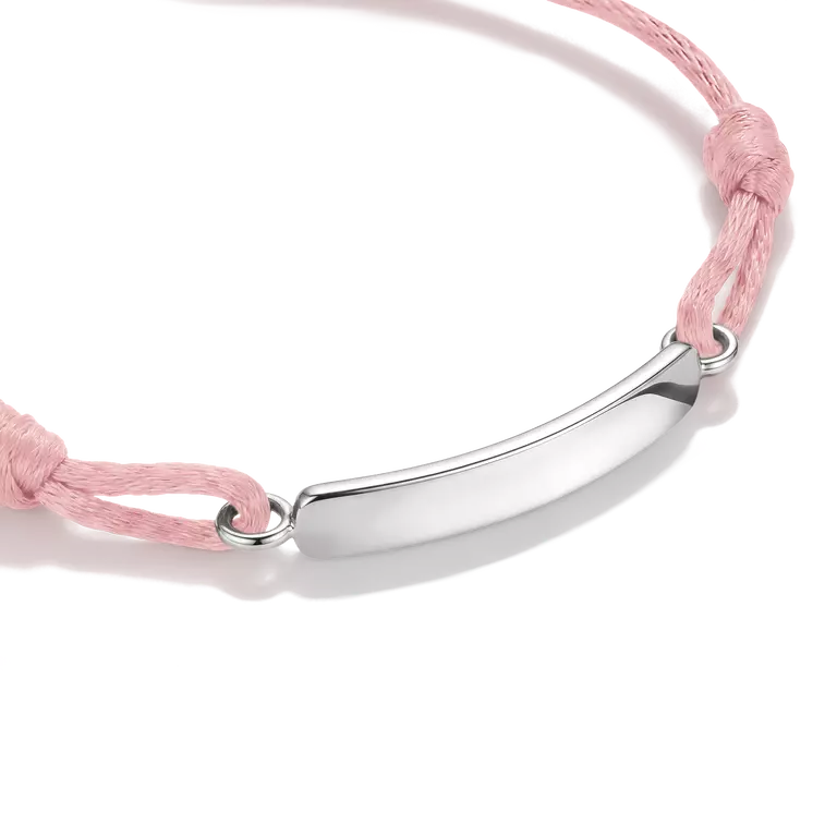 A delicate pink cord bracelet with a polished silver-tone oval plate in the center, displayed on a clean white background.