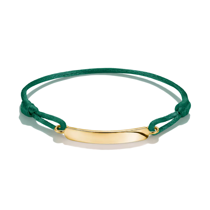 A green cord bracelet with a polished gold ID plate, displayed on a clean white background.
