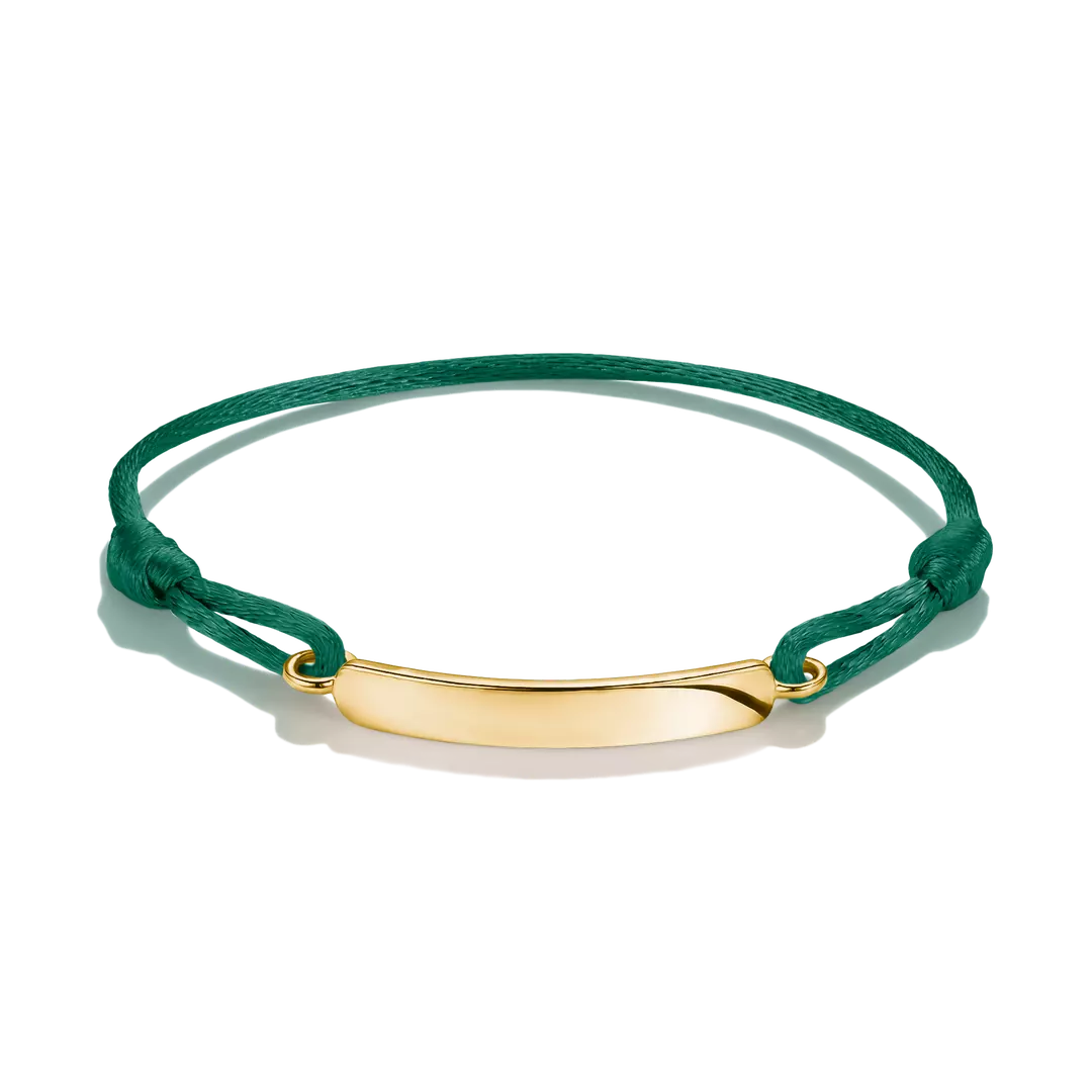 A green cord bracelet with a polished gold ID plate, displayed on a clean white background.