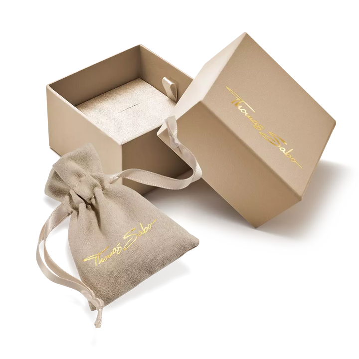 Open beige jewelry box with a drawstring bag featuring 'Tiffany & Co.' branding on a white background.