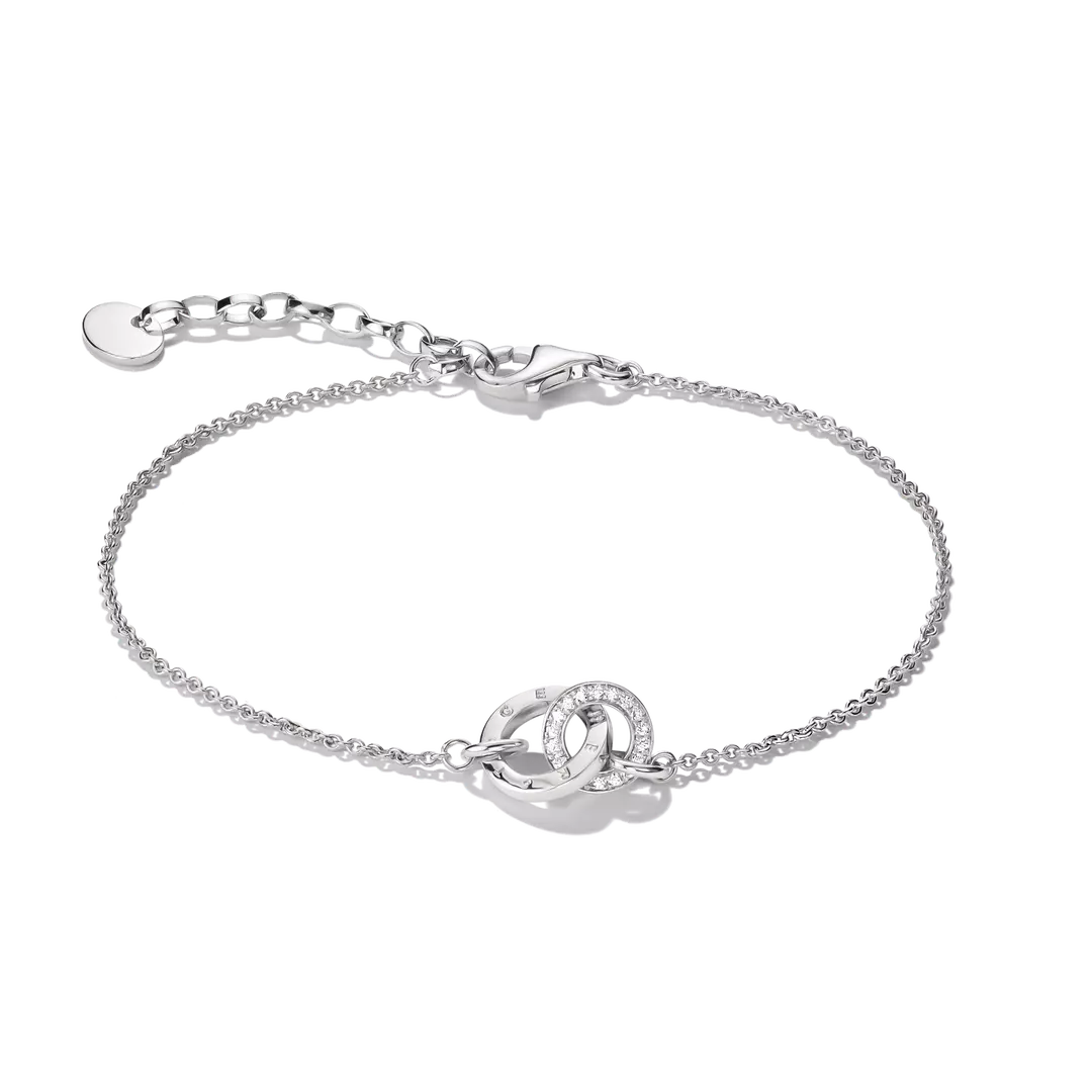 A silver chain bracelet with a central interlocking double-ring motif, one of which is set with small clear stones, shown on a plain white background.