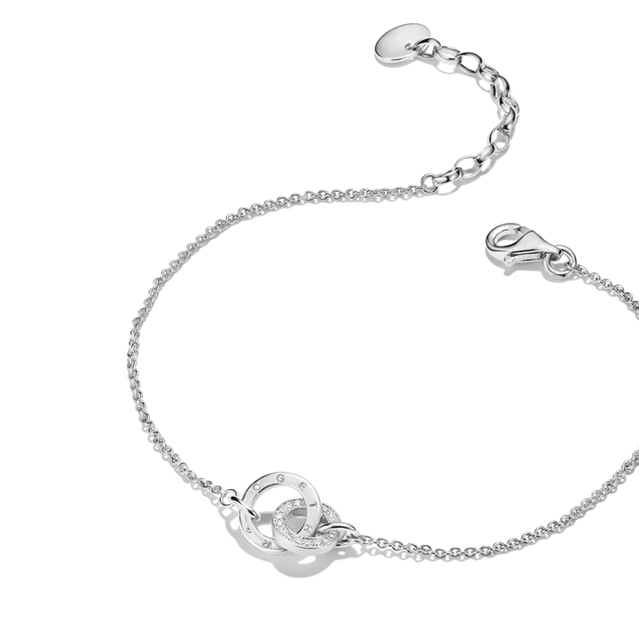 A silver chain bracelet featuring a central interlocking double-ring motif with a small pavé accent, shown on a clean white background.