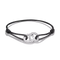 A black cord bracelet with two interlocking silver rings, one of which is paved with small clear stones and features the text 'I WILL NEVER FORGET YOU' engraved on the other, shown on a white background.