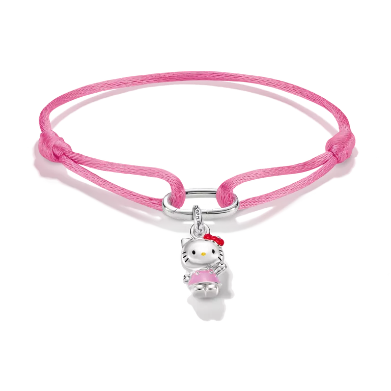 A pink braided cord bracelet featuring a silver Hello Kitty charm with a pink dress and red bow, displayed on a clean white background.