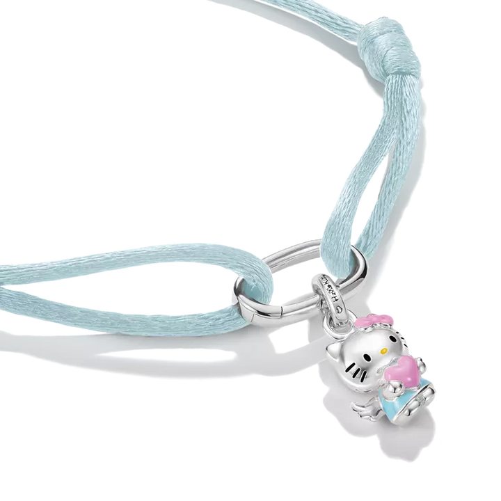 A light blue cord bracelet featuring a silver-toned Hello Kitty charm holding a pink ice cream cone, shown on a clean white background.