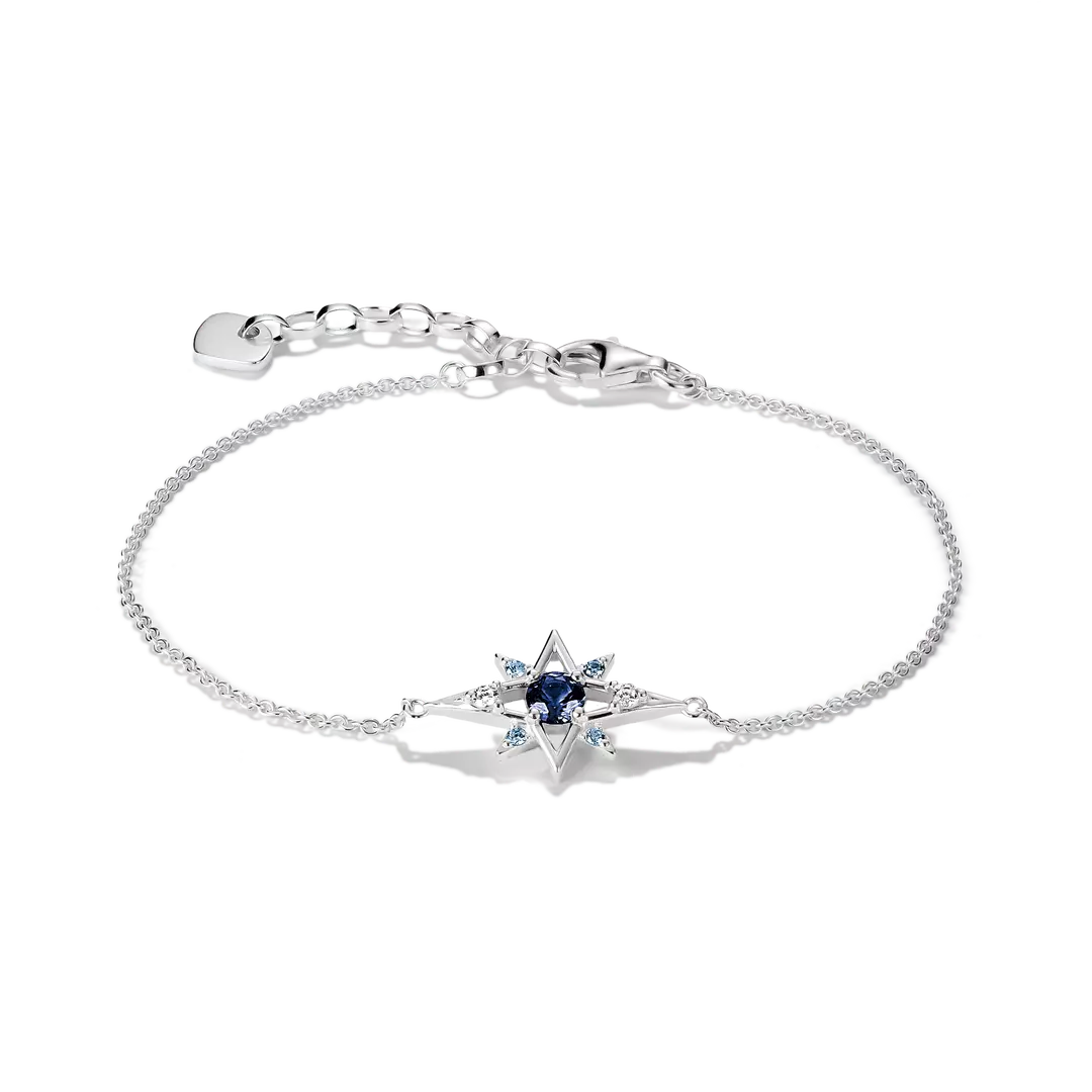 A silver chain bracelet with a central star-shaped charm featuring a dark blue oval center and small light blue stones, shown on a clean white background.