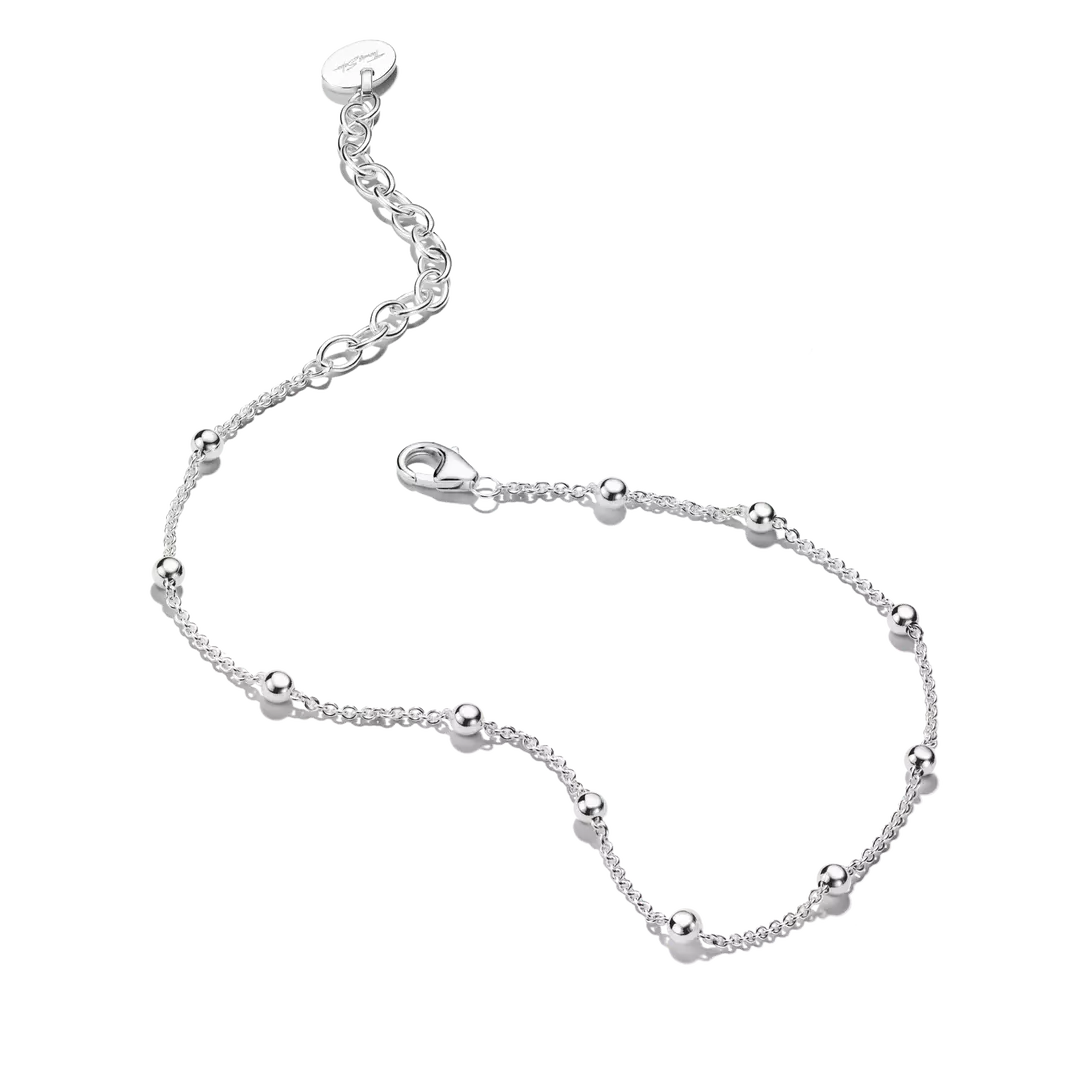 A delicate silver chain bracelet with small polished bead accents and an adjustable lobster clasp, shown on a plain white background.