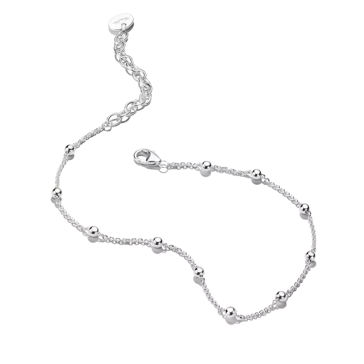 A delicate silver chain bracelet with small polished bead accents and an adjustable lobster clasp, shown on a plain white background.