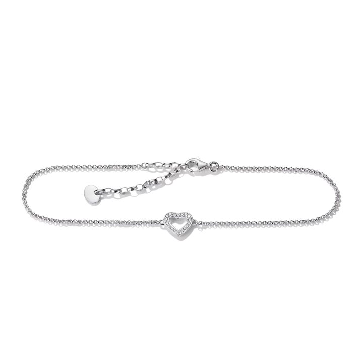 A delicate silver chain bracelet with a small heart-shaped charm set with clear stones, displayed on a clean white background.
