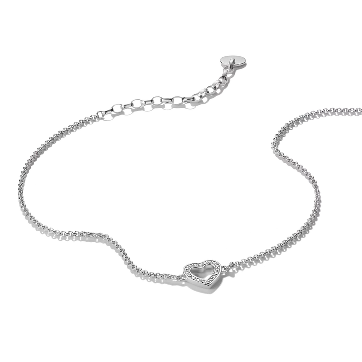 A delicate silver chain bracelet with a small heart-shaped pavé center and an adjustable lobster clasp, shown on a plain white background.