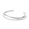 A polished silver open cuff bangle bracelet with a smooth, curved organic shape, displayed on a clean white background with a soft shadow.