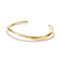 A polished gold open cuff bangle bracelet with a smooth, curved organic shape, displayed on a clean white background with a soft shadow.