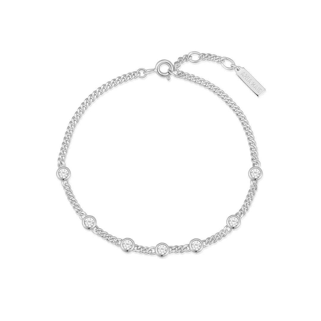 Silver bracelet with small diamonds on a white background