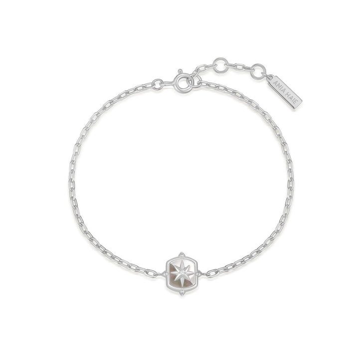 Silver bracelet with a star-shaped clasp on a white background