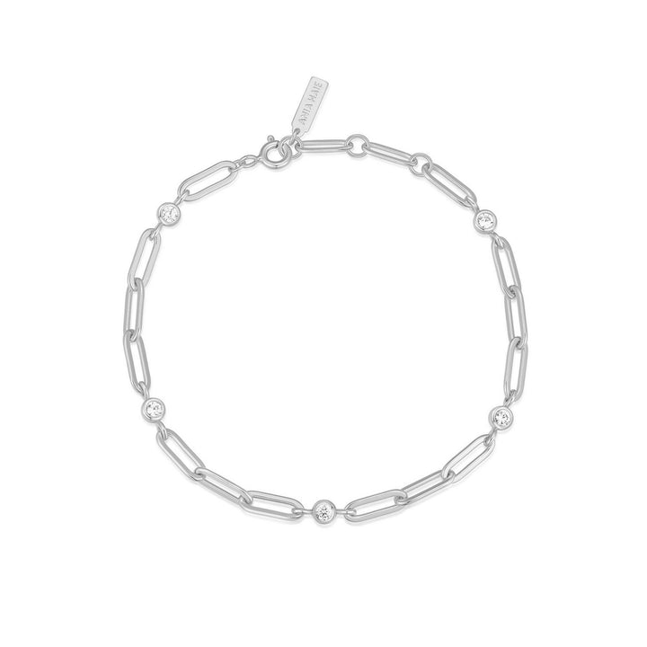Silver chain bracelet with small round links on a white background