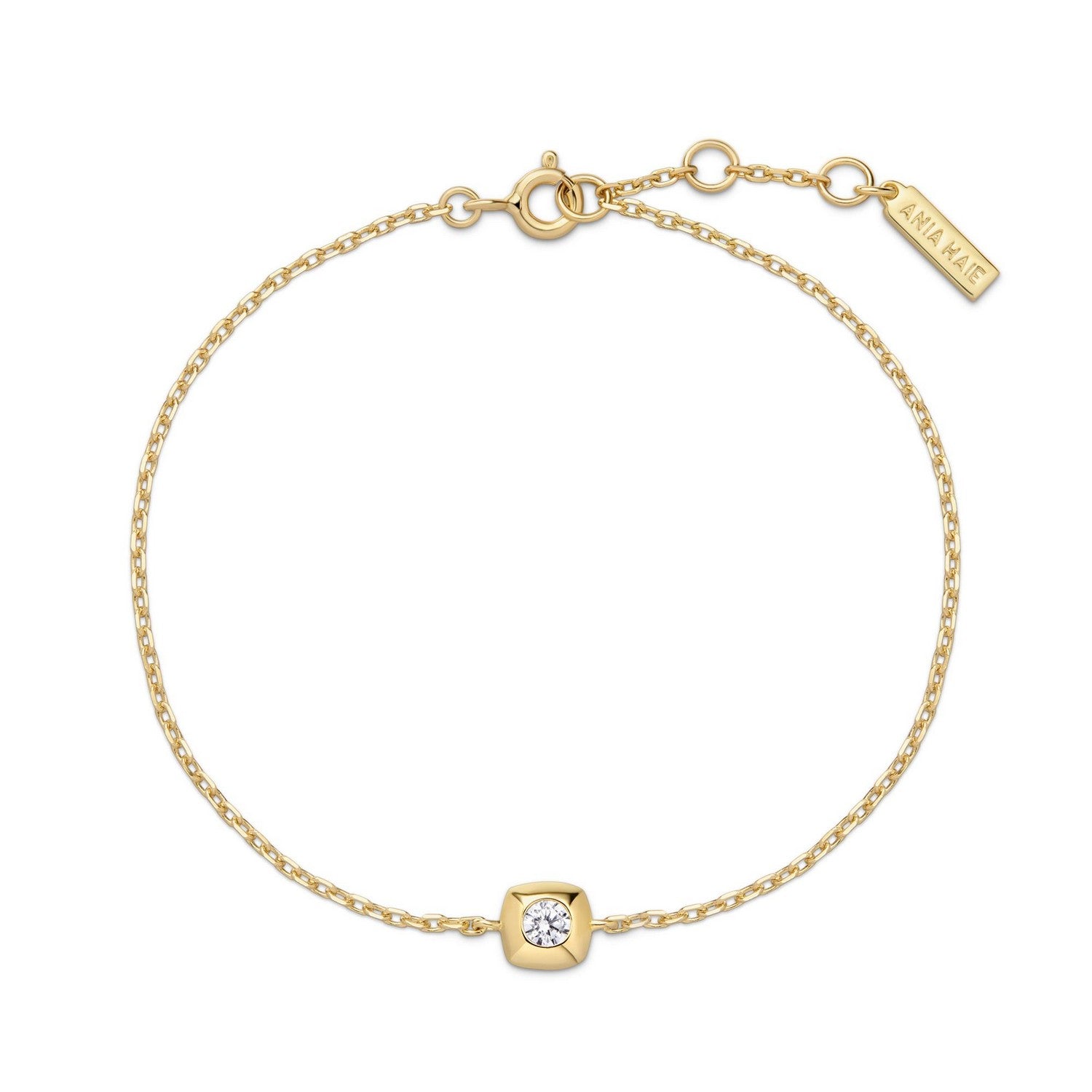 Gold bracelet with a diamond charm on a white background