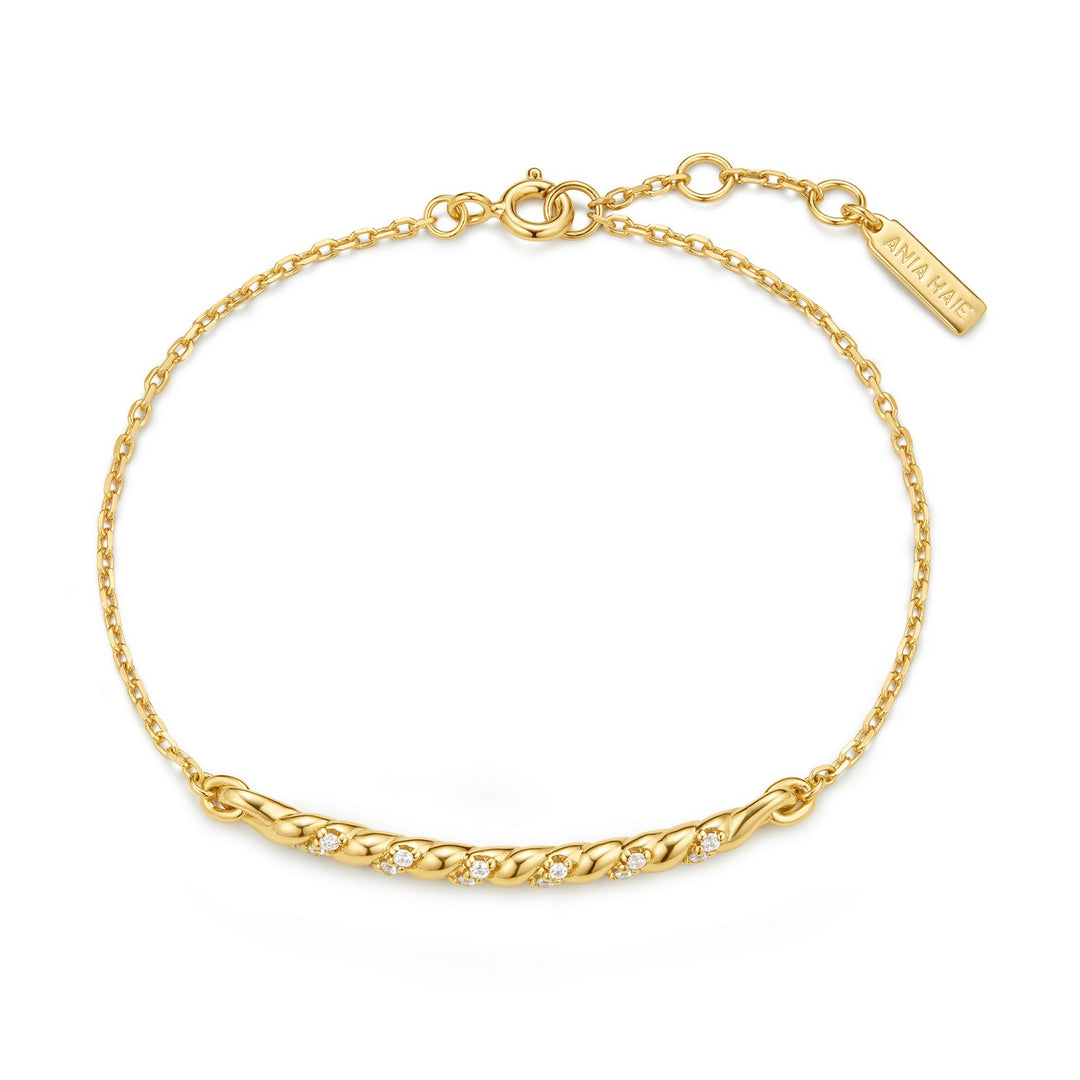 Gold bracelet with a chain design on a white background