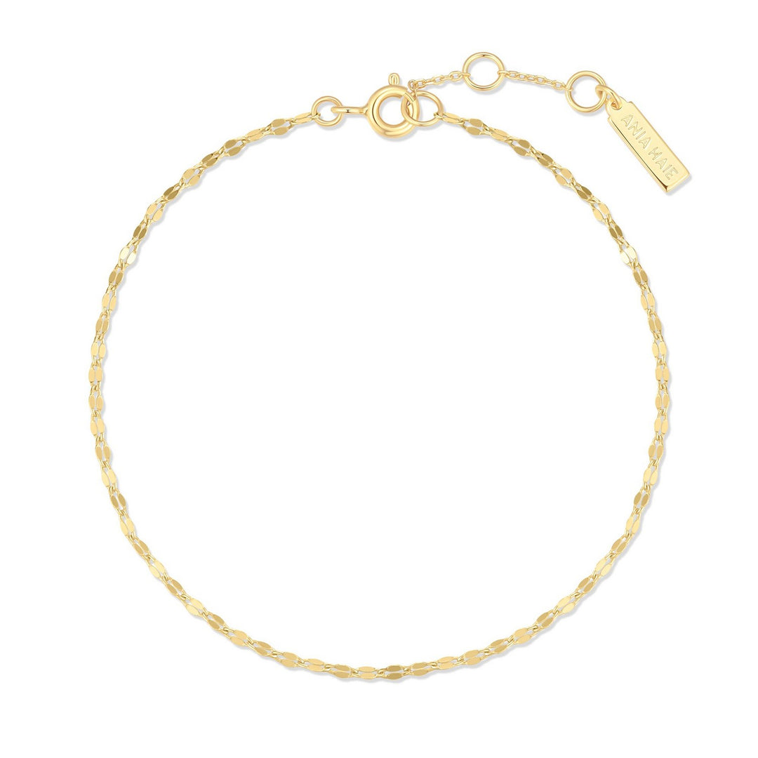 Gold bracelet on a white background