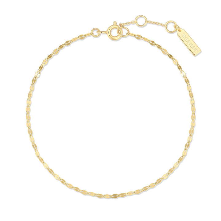 Gold bracelet on a white background