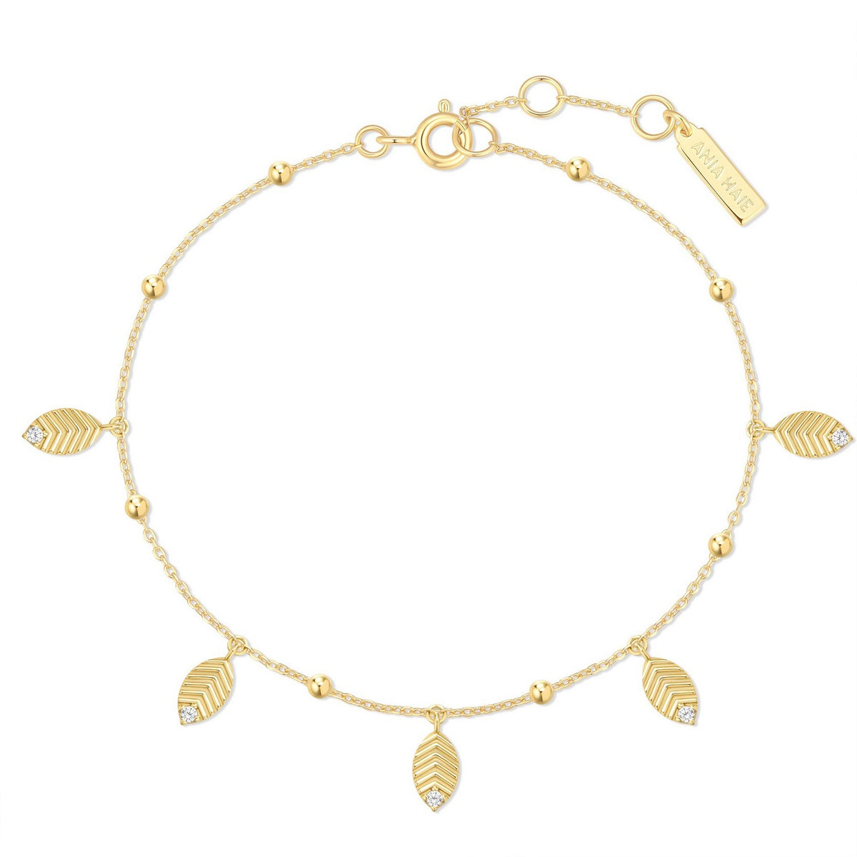 Gold bracelet with leaf-shaped charms on a white background