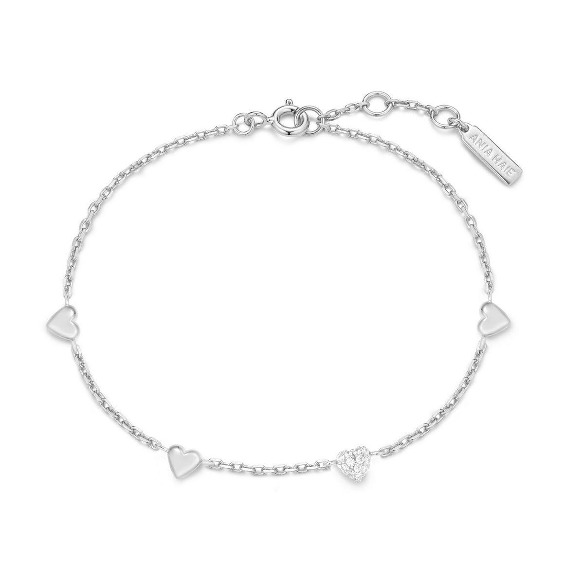 Silver bracelet with heart-shaped charms on a white background