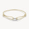 Beige braided bracelet with a silver clasp on a white background