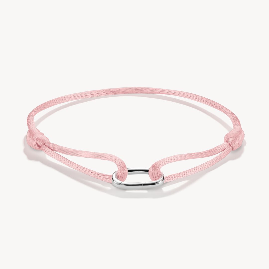 Pink bracelet with a silver clasp on a white background